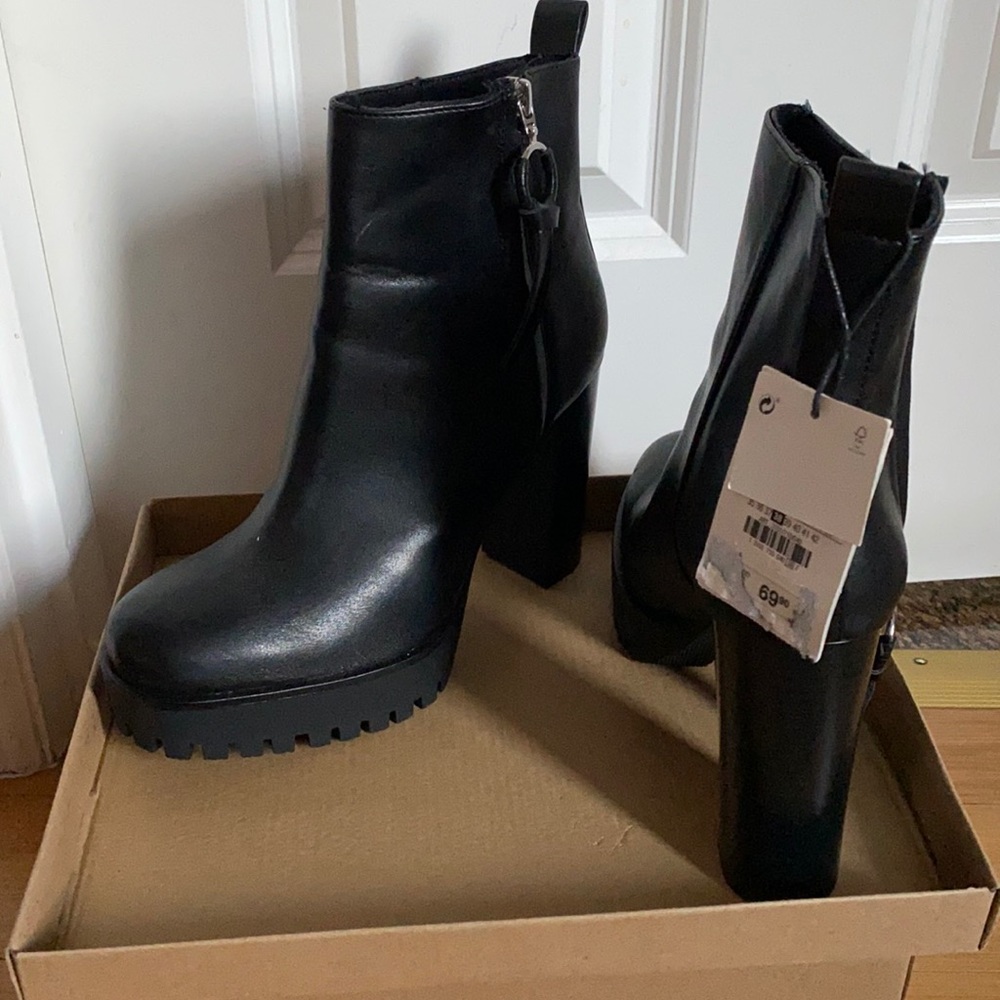 Women gorgeous black ankle boots high heels.